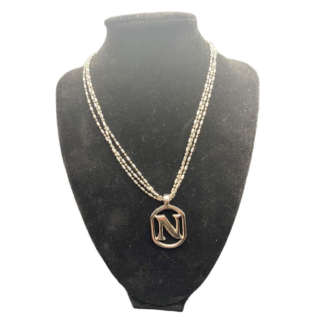 Three chain silver tone necklace with monogram “N” heart clasps